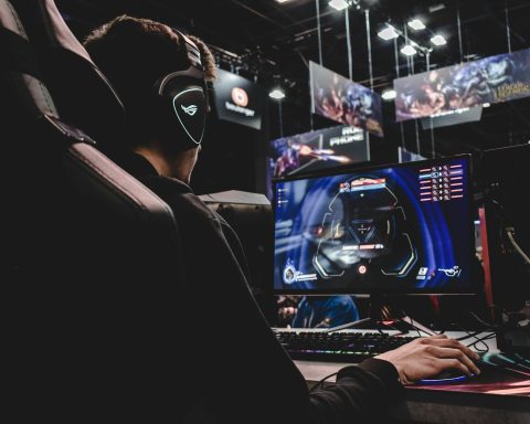 person sitting on gaming chair while playing video game