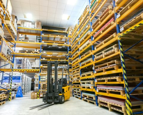 a large warehouse filled with lots of pallets