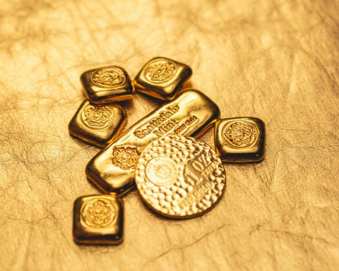 a bunch of gold bars sitting on top of a table