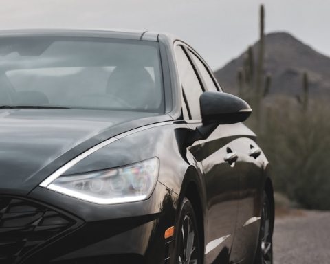 black sedan parking near road