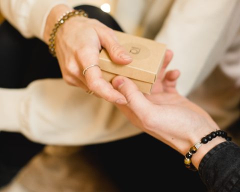 person holding gold iphone 6