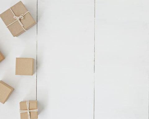 brown gift box on white surface