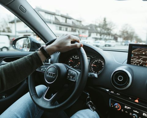 person driving car during daytime