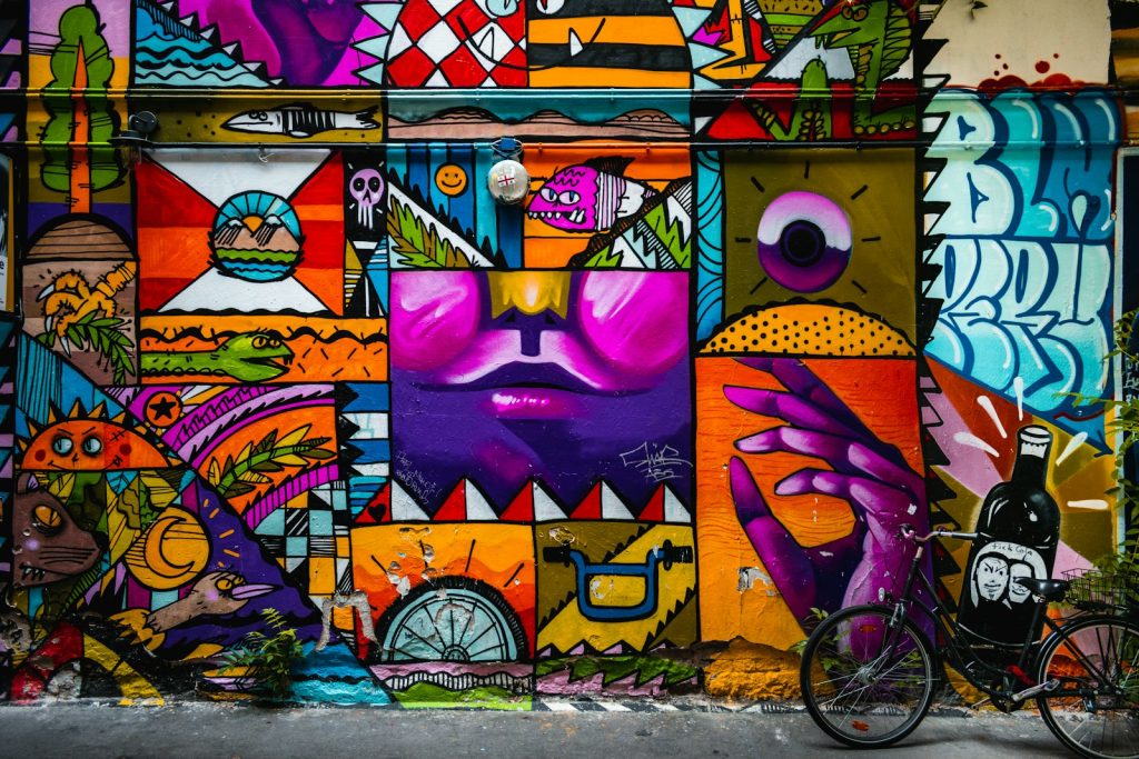 purple yellow and pink wall graffiti
