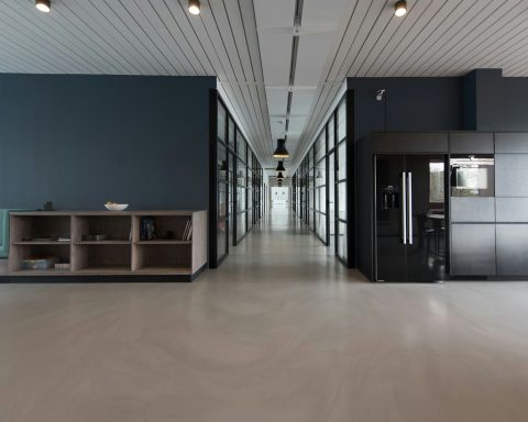 architectural photography of black and brown hallway