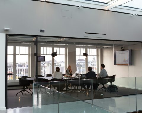people sitting on chair inside building