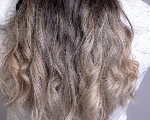 woman in white shirt with blonde hair