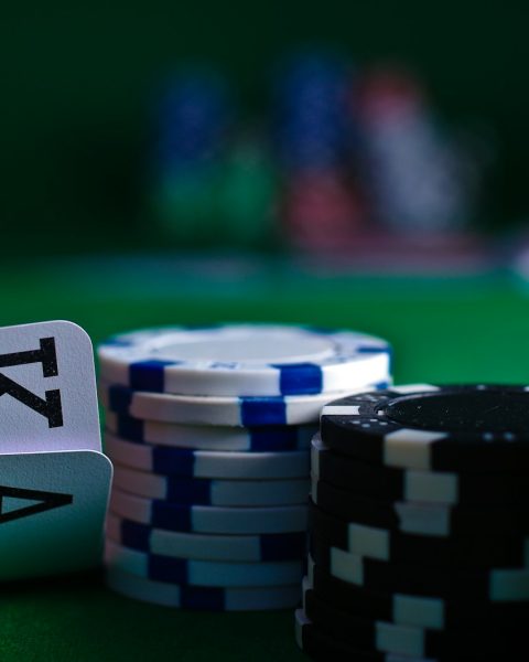 white and black dice on green table