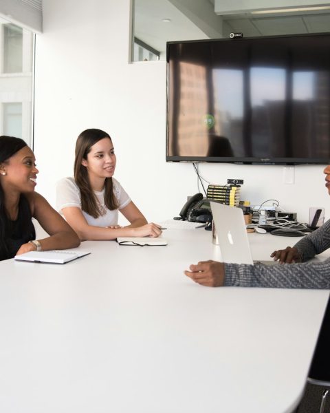 three women sitting at the table